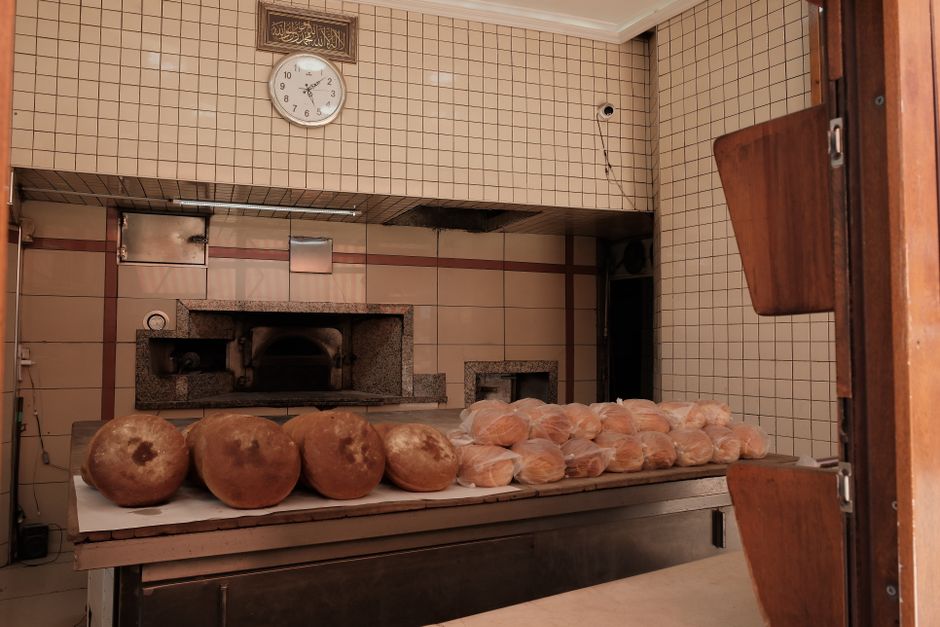 Loaves of fresh bread on display inside a traditional bakery